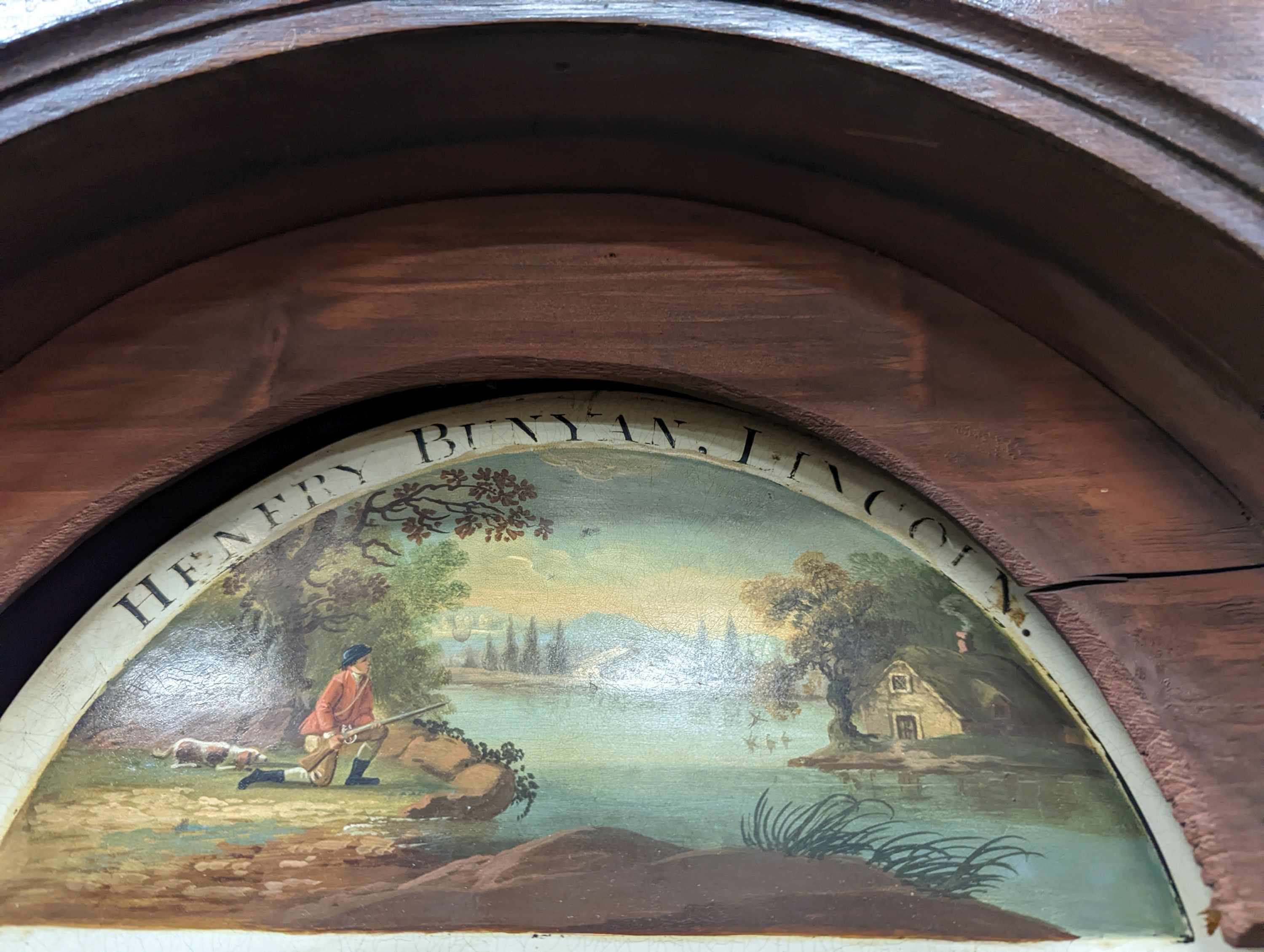 An early 19th century oak eight day longcase clock, the painted dial marked Henry Bunyan, Lincoln, (case in two sections) height 224cm